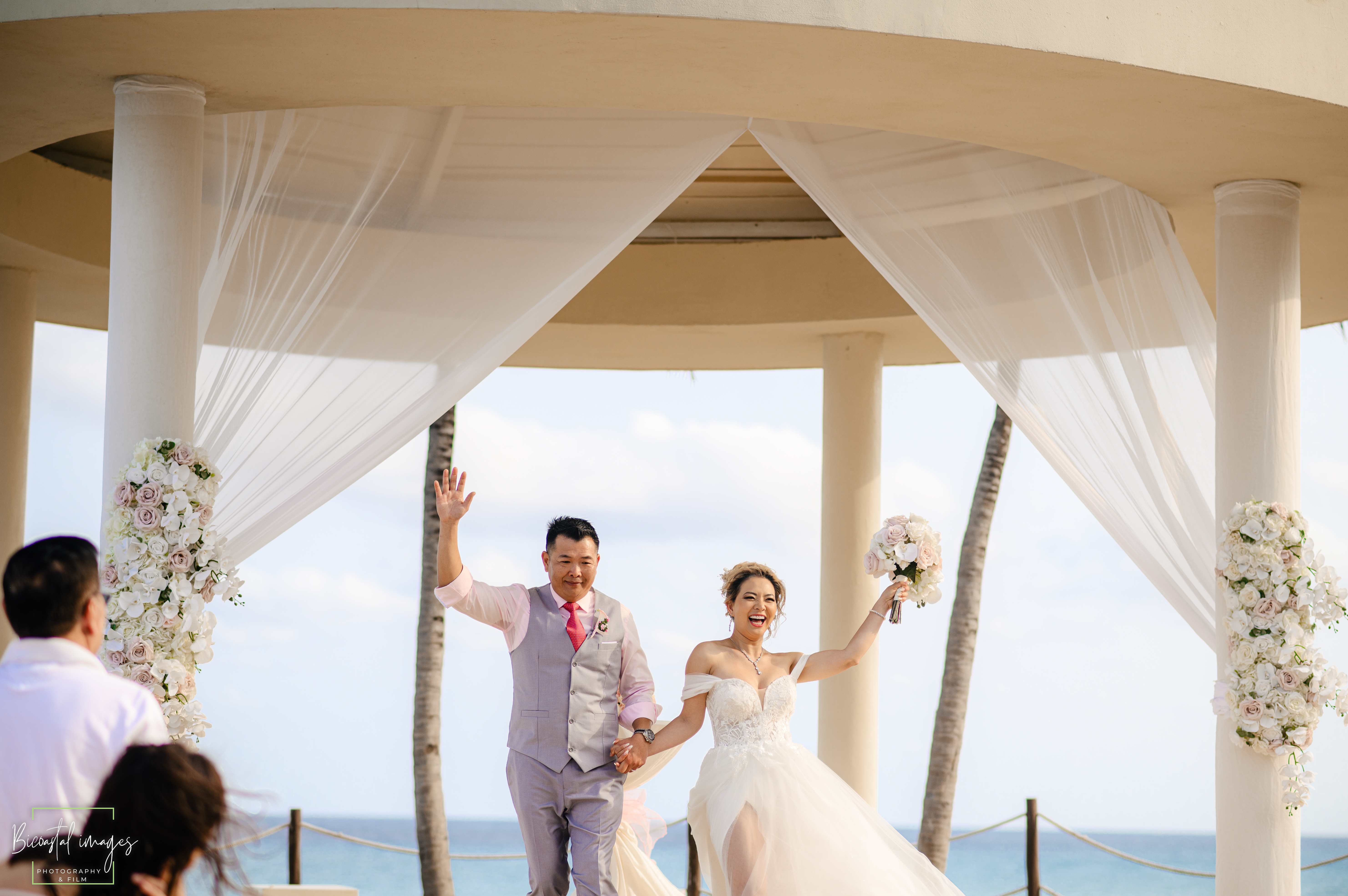 Joyful ceremony exit celebration under gazebo